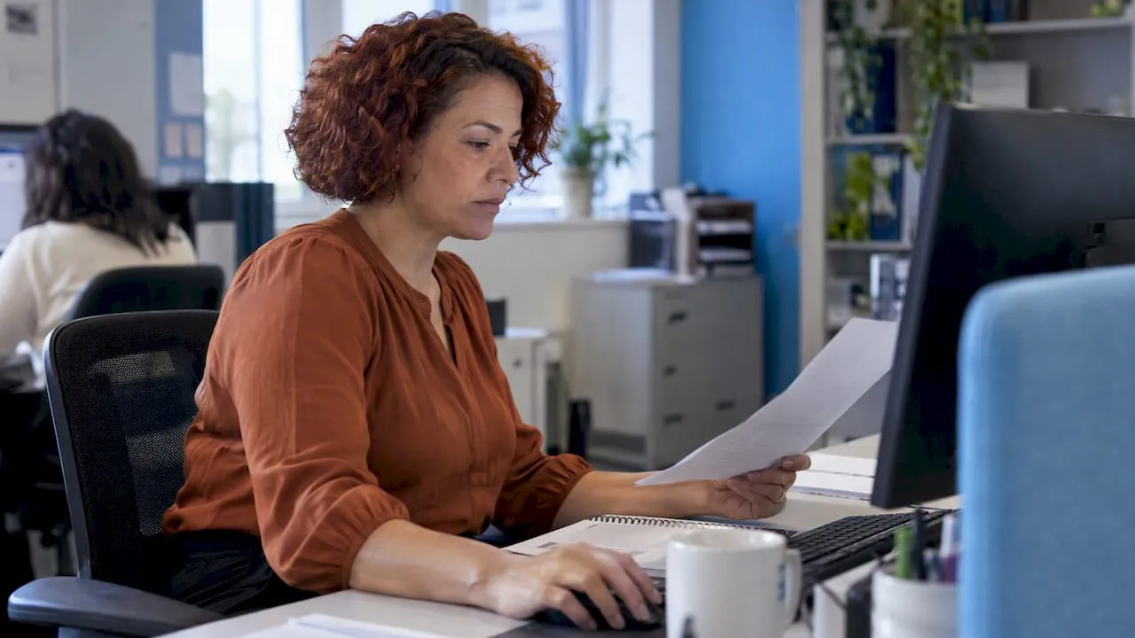 Finance officer reviewing an invoice draft