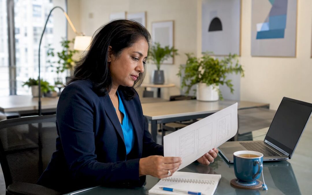 Businesswoman reviewing website redesign plans