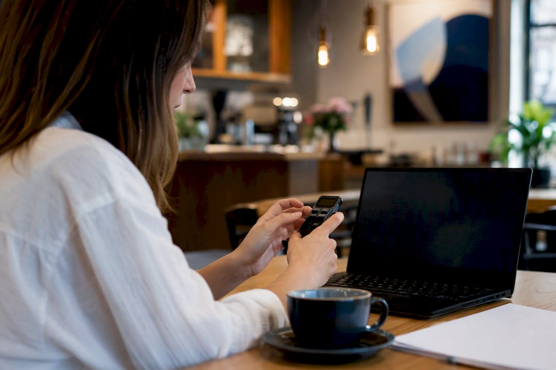 Hands configuring smart device for workflow triggers